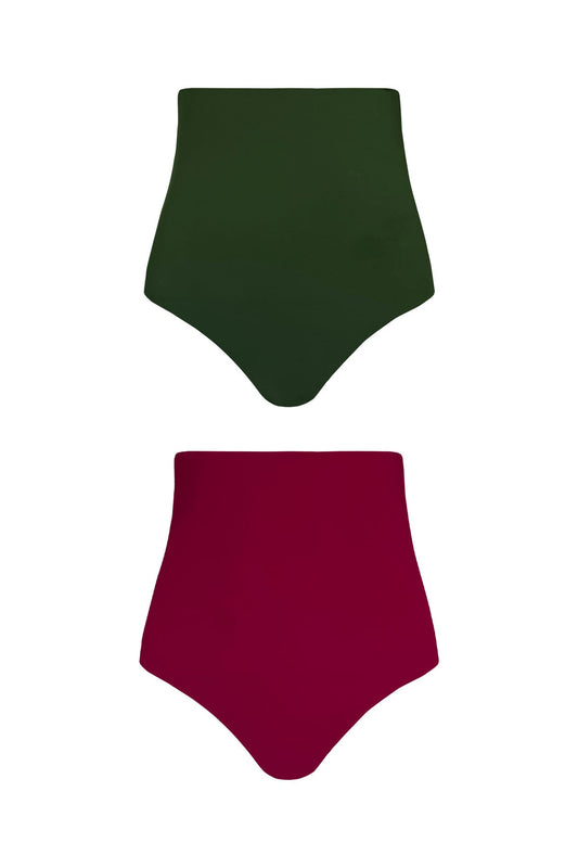 A product image showing each reversible side of the Gaia bikini bottoms. One pair of bottoms shows the raspberry pink side, whilst the other features a complimentary deep green colour.