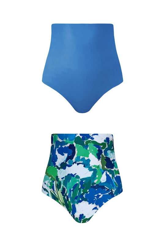 Woman wears reversible blue high-waisted bikini.