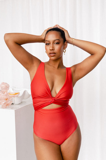 Woman wearing red bikini with tie at front 