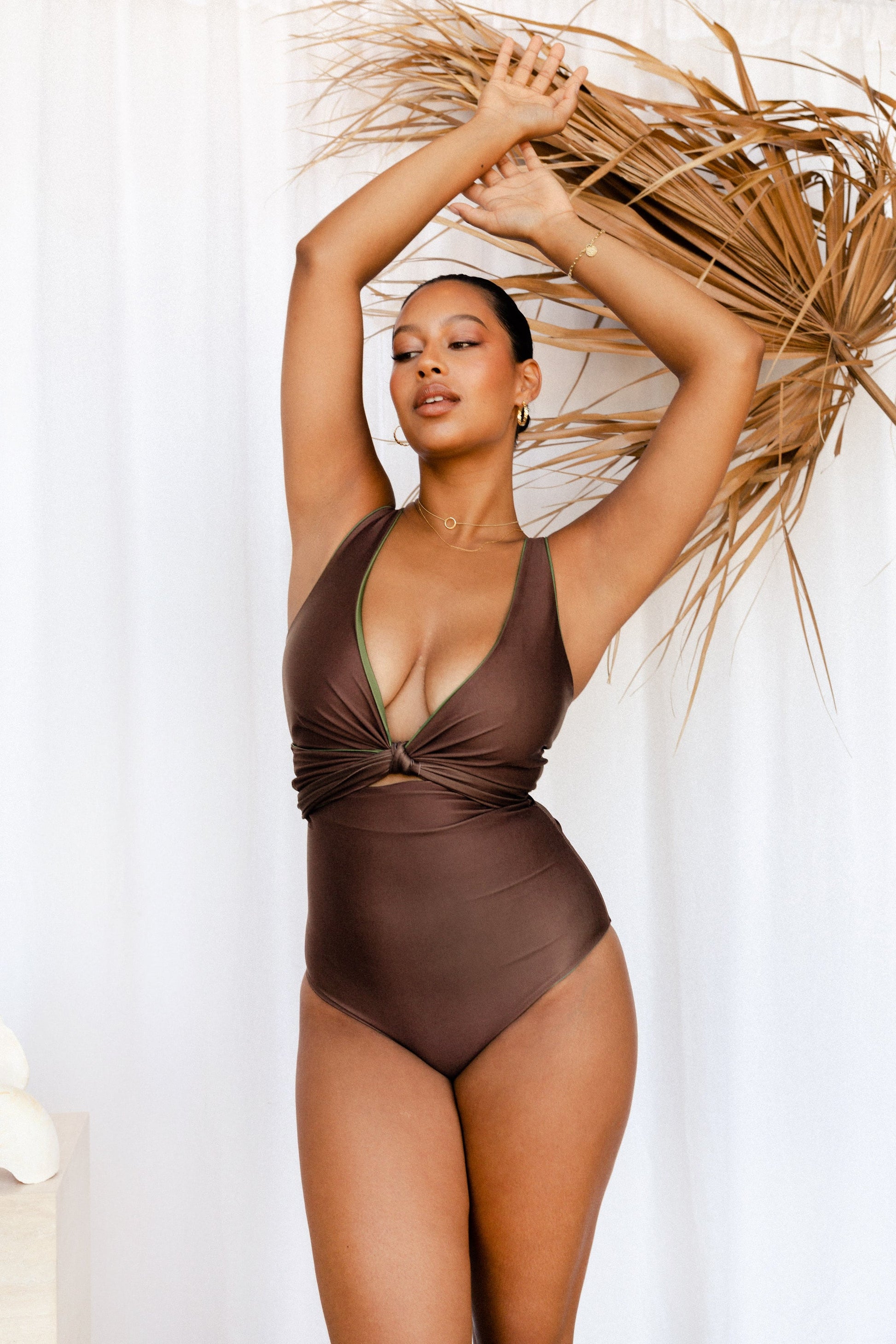 Woman wearing solid brown seamless bikini 