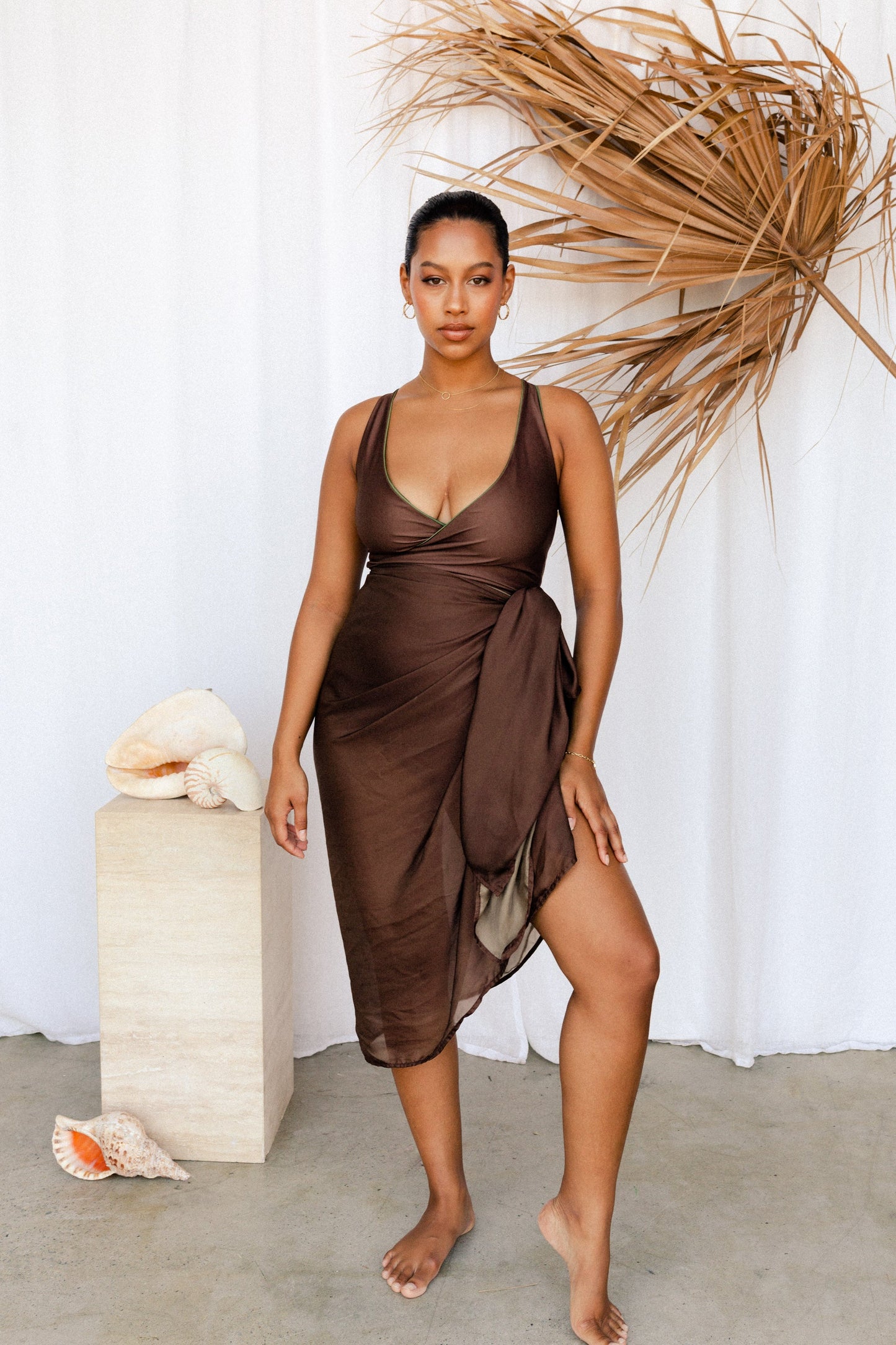 Brown sarong paired with a bikini top
