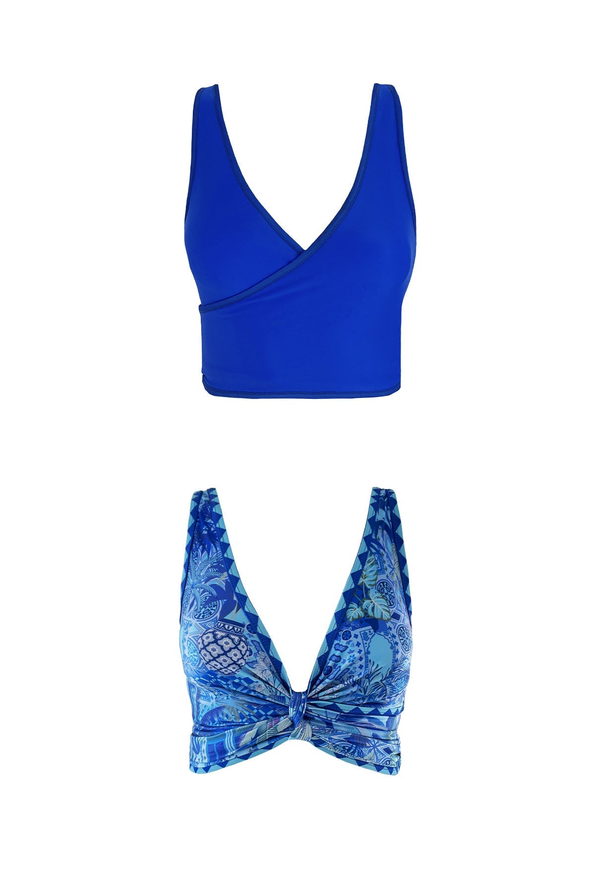 Product image showcasing both reversible sides of the Capri bikini top. One is a solid ultramarine blue and the other features a blue toned Italian motif inspired print, cinched at the bust to create a lower cut neckline.