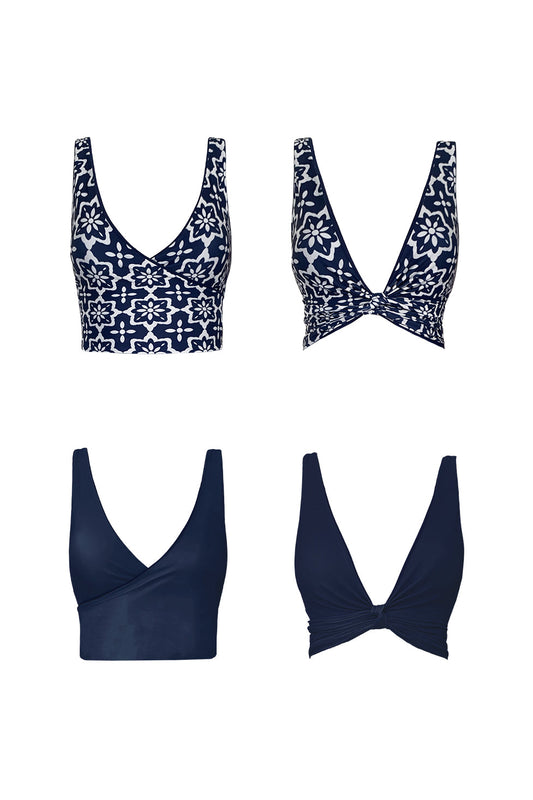 Product image showing each reversible side of the Riad bikini top. One side shows the block midnight navy colour, the other features a striking geometric tile print.